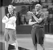  ?? JASON BEEDE/ORLANDO SENTINEL ?? UCF men’s basketball coach Johnny Dawkins watches practice Tuesday at Addition Financial Arena.