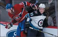  ?? THE CANADIAN PRESS/PAUL CHIASSON ?? Winnipeg Jets’ Sami Niku avoids a check by Montreal Canadiens’ Nicolas Deslaurier­s during second period NHL hockey action Tuesday in Montreal.