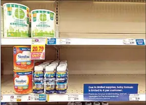  ?? MICHAEL CONROY / AP, FILE ?? Baby formula is displayed on the shelves of a grocery store with a sign limiting purchases in Indianapol­is on May 12, 2022.