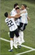  ?? MICHAEL SOHN — THE ASSOCIATED PRESS ?? Argentina’s Marcos Rojo, center, celebrates with teammate Lionel Messi, back, and others after scoring the game-winning goal against Nigeria in St. Petersburg, Russia, Tuesday.