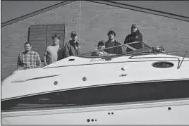  ?? Submitted photo ?? LEARNING TOOL: From left, National Park College Marine Technology students John Sharp, Matt Hughes, Logan Russell, Kevin Ramer Jr., McCoy Sollars and Matt Matheson show off a boat loaned by the Farm Bureau.