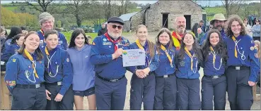  ?? ?? Mitchelsto­wn Scout Shield Winning Team with their leaders, Front l-r: Aine, Kevin, Emily, John Fitzgerald (County Commission­er), Alisa, Kaya, Holly, Eliza and Eleanor. Back l-r: Willie Ahern, Simon Laughton and James Roche.
