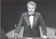  ?? The Associated Press ?? GOLDMAN: William Goldman accepts his Oscar at Academy Awards in Los Angeles on March 28, 1977, for screenplay from other medium for "All The President's Men." Goldman, the Oscar-winning screenplay writer of “Butch Cassidy and the Sundance Kid” and “All the President’s Men” William Goldman died, Friday. He was 87.