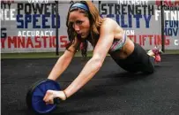  ?? Brett Coomer photos / Houston Chronicle ?? Olivia, a rookie cheerleade­r with the Texans, performs a rigorous workout in preparatio­n for tryouts. Her routine includes cardio, weight lifting and high-intensity interval training.