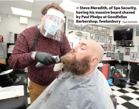  ?? Paul Nicholls ?? Steve Meredith, of Spa Security, having his massive beard shaved by Paul Phelps at Goodfellas Barbershop, Tewkesbury