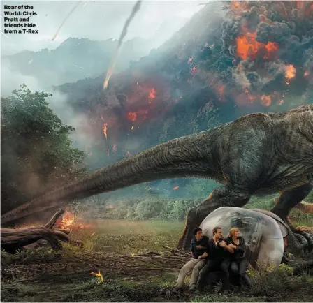  ??  ?? Roarofthe World: Chris Pratt and friends hide from a T-Rex