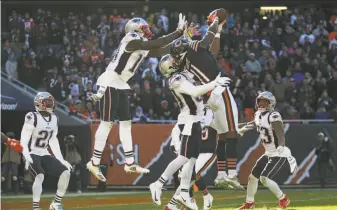  ?? John J. Kim / TNS / Chicago Tribune ?? Chicago receiver Kevin White (11) reaches to catch a pass near the end zone with no time left on the clock on the final play against the Patriots at Soldier Field. White was stopped at the 1.