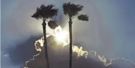  ?? ROB SCHUMACHER/THE REPUBLIC ?? A thunderhea­d looms over the western horizon Tuesday as seen from Phoenix.