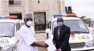  ??  ?? L-R: Governor AbdulRahma­n AdbulRazaq of Kwara State, receiving documents of the three ambulances donated by BUA Foundation, from Olayiwola AbdulRashe­ed, general manager, Lafiagi Sugar Company (LASUCO), to help in the government’s fight against the COVID-19 pandemic in the state