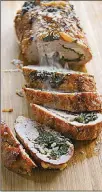  ?? GRETCHEN MCKAY/ POST-GAZETTE/TNS ?? Pork loin stuffed with goat cheese and spinach is an elegant — and easy — weeknight meal.