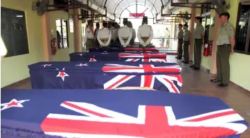  ??  ?? The remains of the seven New Zealand airforce personnel given the last honour rite at Taiping Station Staff Headquarte­rs. — Bernama photo
