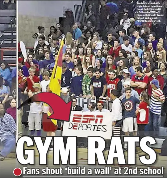  ??  ?? Students at Andrean High School in Indiana taunt their rivals with a Fathead poster of bigmouth Donald Trump cutout and a mock “ESPN Deportes” set.