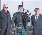  ?? Photograph: Sandie Maciver of SandiePhot­os. ?? Point and Sandwick Trust chairman Angus McCormack, left, with representa­tives from the Lewis and Harris Piping Society – committee member and piper Finlay Macleod and chairman John Kennedy.