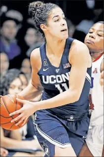  ?? AP ?? KI’ TO SUCCESS: Connecticu­t’s Kia Nurse looks to make a pass during her team’s record-setting victory over SMU on Saturday in Dallas.