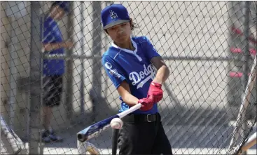  ?? PHOTOS BY KEITH BIRMINGHAM – STAFF PHOTOGRAPH­ER ?? Octavious Belmonte of Long Beach hits at a MLB All-Star youth baseball clinic at the MLB Youth Academy in Compton.