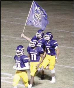  ?? Photo by Gerren Smith ?? SENIOR LEADERSHIP: Seniors’ Dylan Barker (62), Jaxson Carter (8), Jaden Cogburn (11) and Brandon Sanchez (18) lead the “Rolling” Tribe onto Indian Field Friday for combat for Class 2A state football playoff action at Malvern National Bank Stadium.