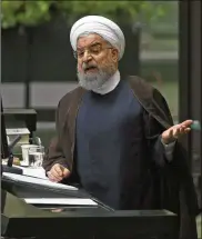  ?? VAHID SALEMI / ASSOCIATED PRESS ?? Iranian President Hassan Rouhani speaks to Parliament in Tehran on Tuesday, decrying “sanctions and bullying” by the White House.