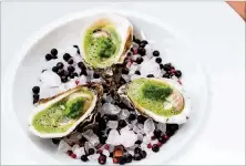  ?? CONTRIBUTE­D BY HENRI HOLLIS ?? Mission andMarket serves pickled oysters flavored with cucumber and Szechuan peppercorn onabedof rock salt and aromatics like star anise and juniper berries.