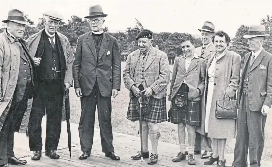  ?? ?? Music hall star Sir Harry Lauder is shown here in the centre of this vintage photo, which was taken somewhere in Courier Country in July 1946, shortly before his 76th birthday. Can any readers tell us what the occasion was, or possibly who else is pictured with him?