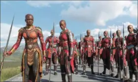  ?? MARVEL STUDIOS ?? Danai Gurira’s Okoye, left, and Florence Kasumba’s Ayo are shown with the Dora Milaje in a scene from “Black Panther.”