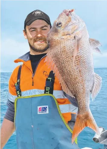  ?? Picture: MURRAY SCOTT ?? Darcy Scott with a snapper he caught offshore from Torquay.