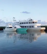  ??  ?? Enterprise, Jon Gonsoulin’s cat-hulled mothership (right) serves as a floating base camp for his team’s fishing and hunting adventures throughout the Gulf of Mexico.