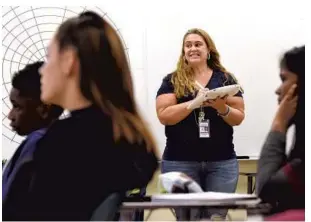  ?? TAIMY ALVAREZ/SUN SENTINEL ?? Vera Obaido teaches students in Delray Beach on Friday. Obaido, a teacher with 21 years of experience in Central Florida, moved to Boca Raton and found a job at Atlantic High School this year.