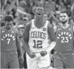  ?? WINSLOW TOWNSON/AP ?? Terry Rozier celebrates at the buzzer after the Celtics won their 12th in a row on Sunday.