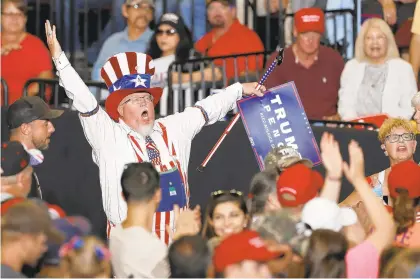  ?? ANDRES LEIGHTON/AP ?? A supporter of President Donald Trump reacts upon his arrival to a campaign rally in Rio Rancho, N.M.