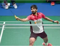  ?? AFP ?? Srikanth Kidambi of India hits a return to Tian Houwei of China during their men’s singles first round match. —