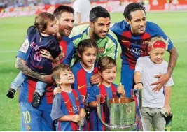  ?? PIC/AP/PTI ?? Barcelona’s Lionel Messi, Luis Suarez and Neymar pose with the trophy and their children after the Copa del Rey final match between Barcelona and Alaves at the Vicente Calderon stadium