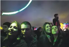  ??  ?? Ashley Zoellner (left), Chelsea Emerson (second from right) and Natalie Sherer groove during Gorillaz’s performanc­e.