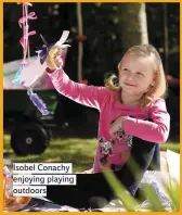  ??  ?? Isobel Conachy enjoying playing outdoors