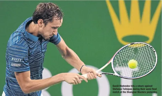  ??  ?? Daniil Medvedev hits a return against Stefanos Tsitsipas during their semi-final match at the Shanghai Masters yesterday.