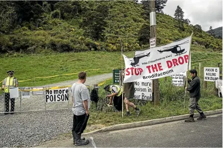  ?? BRADEN FASTIER/STUFF ?? Protesters outside Brook Sanctuary near Nelson as aerial poison was dropped in October 2017.