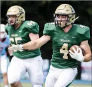  ?? MEDIANEWS GROUP PHOTO ?? Lansdale Catholic’s Peter McHugh (4) carries the ball downfield for a big gain against Father Judge last season.