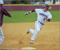  ?? PETE BANNAN — DIGITAL FIRST MEDIA ?? West Chester Henderson’s Brendan Gray rounds third to score in the sixth inning as the Warriors broke open a close game against Coatesvill­e to win 10-0 at home Monday.