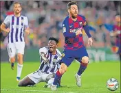  ?? GETTY IMAGES ?? Lionel Messi gets past Mohammed Salisu of Valladolid.