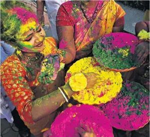  ??  ?? Indian students celebratin­g the Holi festival. One third of the Stewart Investors Asia Pacific Sustainabi­lity fund is invested in the country