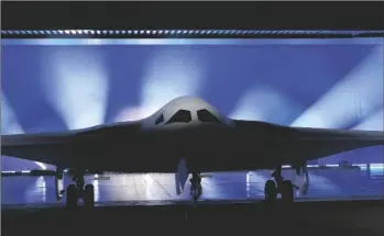  ?? AP PHOTO/MARCIO JOSE SANCHEZ ?? The B-21 Raider stealth bomber is unveiled at Northrop Grumman on Friday, in Palmdale, Calif.