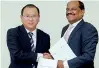  ??  ?? CHEC Port City Colombo (Pvt) Ltd Managing Director Jiang Houliang exchanges the MOU with NSBM Green University Town Vice Chancellor Prof. E. A. Weerasingh­e