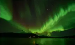  ?? ?? The stunning Northern Lights. Below: Torghatten Mountain’s hole.