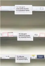  ??  ?? ALL GONE Stores issued rationing notices to customers but shelves were still stripped bare of essentials yesterday