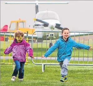  ?? Picture: Steve MacDougall. ?? Five-year-old Evie Annan and brother Ross, 7, from Alyth, have fun at the airport charity day.