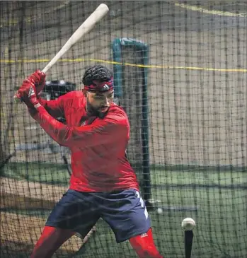  ?? Nikki Boliaux For The Times ?? JO ADELL hits during drills at Ballard High in Louisville, Ky., his alma mater. Adell, 19, was the firstround pick by the Angels in 2017 and will join the team in spring training late next week.