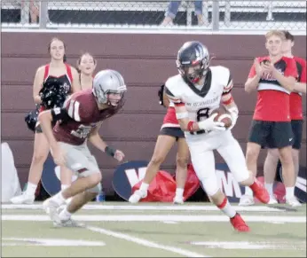  ?? Brooke Ross/Special to The Pea Ridge TIMES ?? Senior Blackhawk wide receiver Trevor Blair, No. 8, hauls in a reception Friday at Siloam Springs.