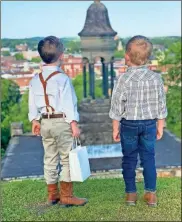  ?? Contribute­d ?? Darlington preschoole­rs Hollis Hoyt (left) and Sawyer West play two of the five founders of Rome in the play “Oh Rome, Georgia, You Are the Place for Me!” Here they are pictured looking down on the town from atop Myrtle Hill Cemetery.