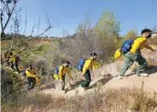  ?? NELVIN C. CEPEDA U-T ?? Marines moved to their next firefighti­ng training event at Camp Pendleton on Friday.