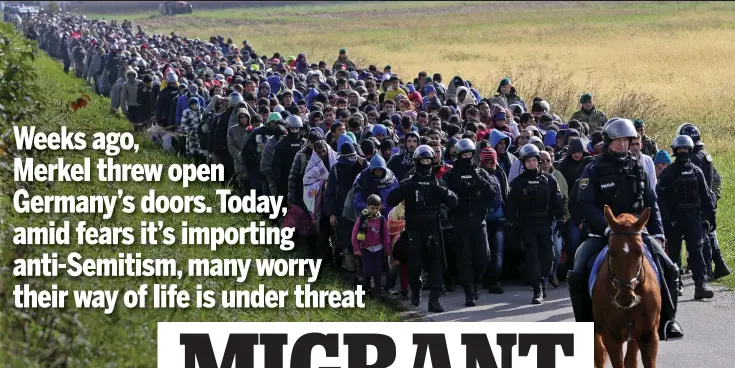  ?? Picture: REUTERS ?? Huddled masses: Migrants being led by police in Dobova, Slovenia, on their way to Germany