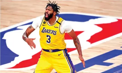  ??  ?? Anthony Davis celebrates after making a three-pointer during the Lakers’ Game 4 victory over the Heat in the NBA finals. Photograph: Kim Klement/USA Today Sports